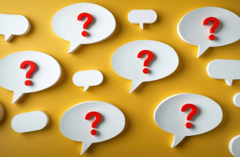 Red question marks in white speech bubbles on a yellow background