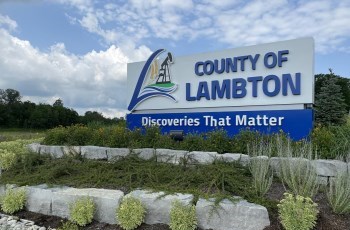 Roadside sign reading County of Lambton Discoveries that matter
